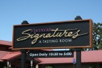 3'x10' MDO sign with 3-D carved urathane copy.  

Lettered in 23K gold Leaf & one shot lettering enamel.  Framed in 2"x12" stained redwood.  Posts are painted P/T fir.