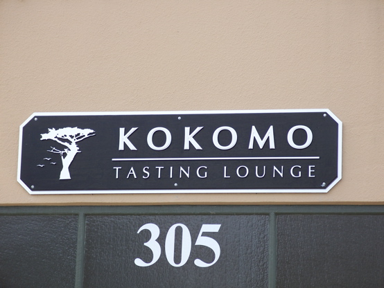 2D brushed aluminum faces on 1/2 plex letters & tree, mounted to an MDO plywood panel & brushed aluminum matte background