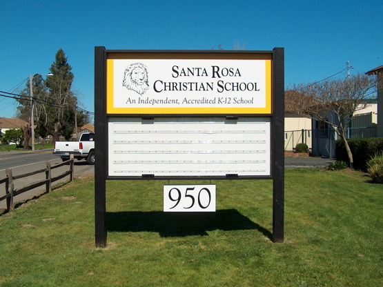 A simple framed MDO panel with a marque added.  There is a 

framed plexi-glass cover over the entire sign