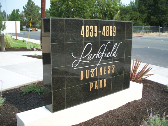 1/8" aluminum letters mounted to an existing tile monument.  Graphics designed in 

house