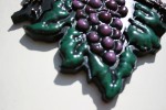 3-d computer carved grapes with antiqued finish.