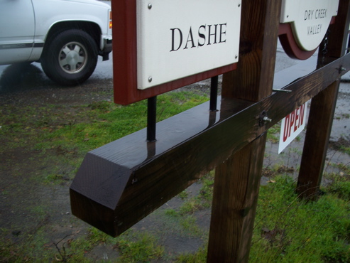1/2" MDO over painted cedar matte.  

Suspended from a redwood structure