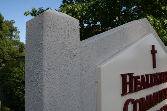 Aluminum pan mounted to a wood structure 

painted with textured material
